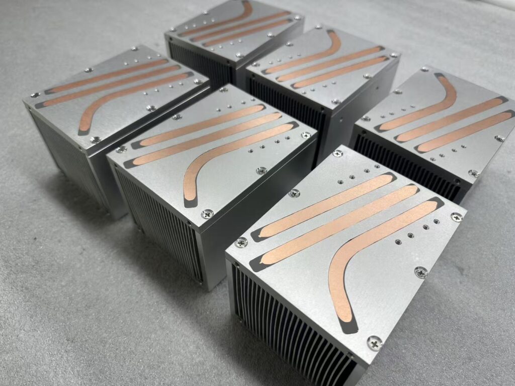 150W Laser Module Heat Pipe Heat Sink — Heat Pipe Routing on Top Plate Top view of 150W laser module heat pipe heat sinks showing copper heat pipes routed across the base plate