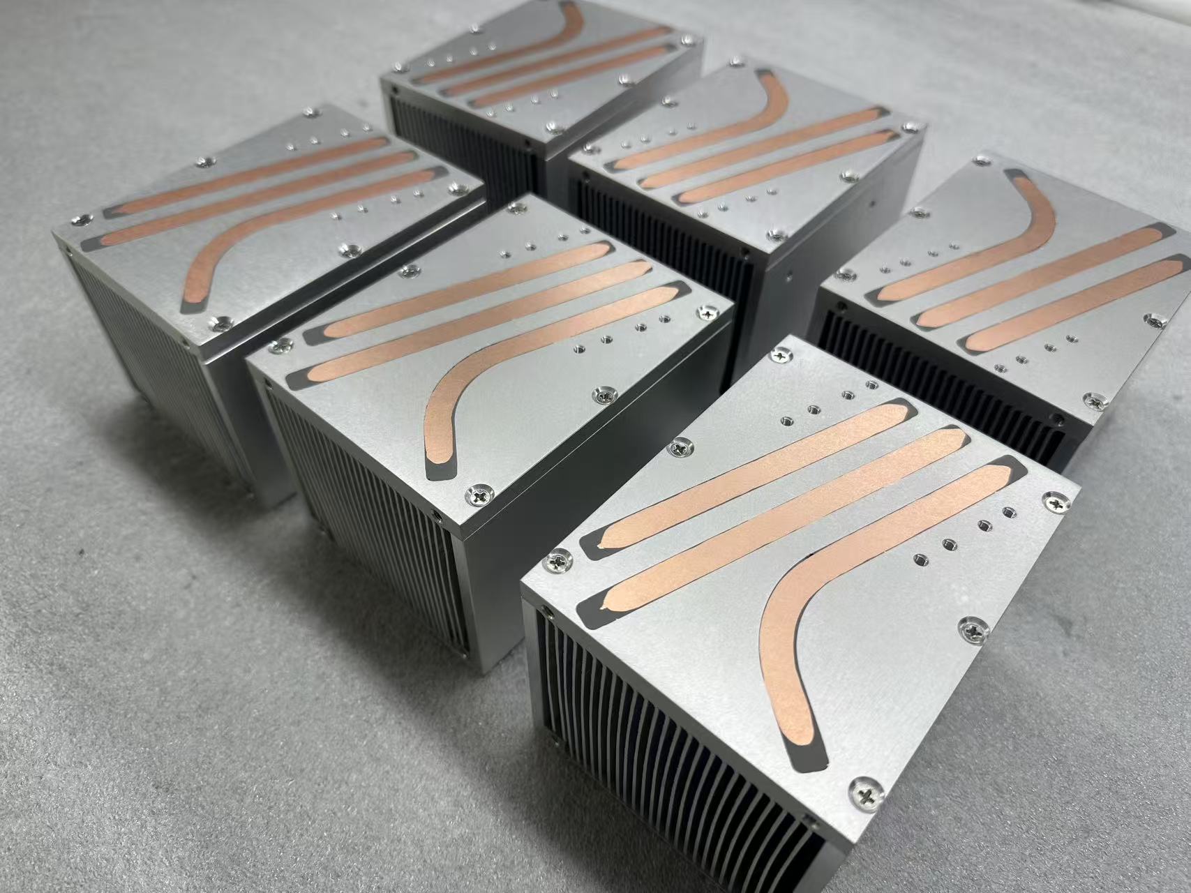 Top view of 150W laser module heat pipe heat sinks showing copper heat pipes routed across the base plate