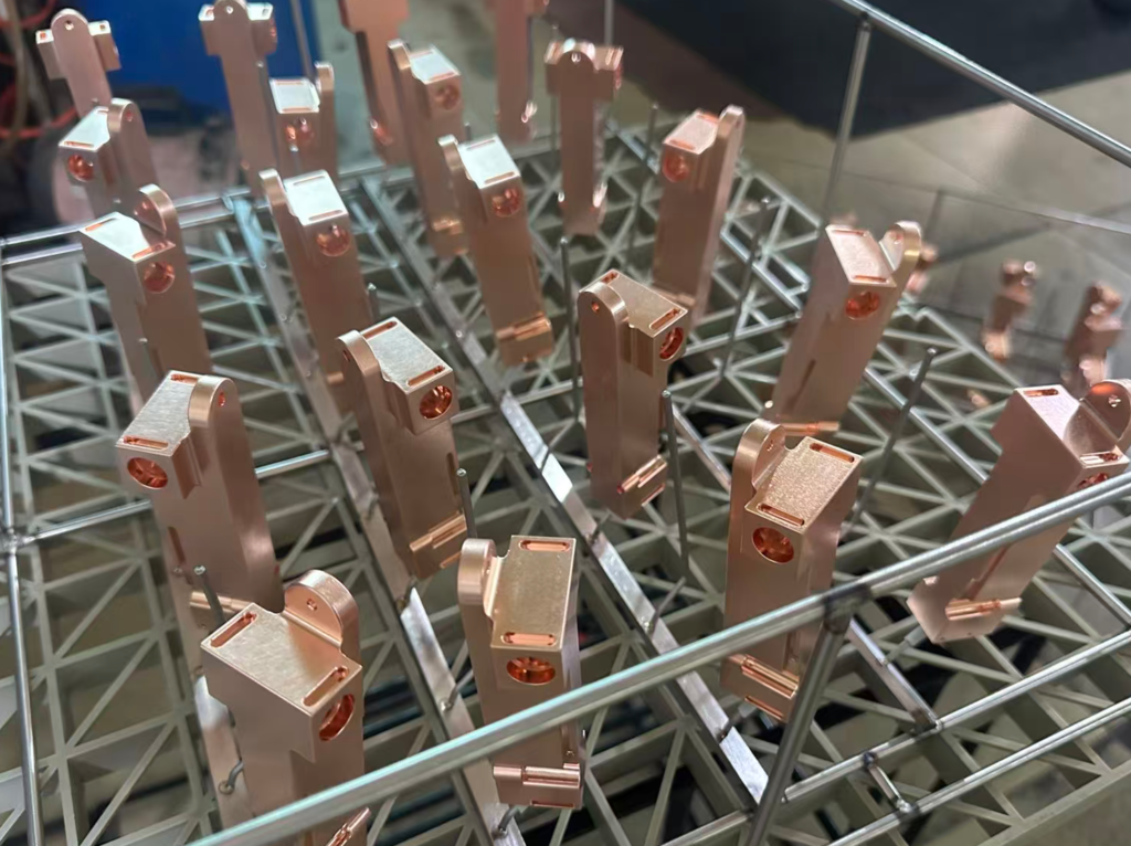 Copper Cold Plate Parts on Plating Line Copper cold plate workpieces in cleaning baskets on the surface plating production line