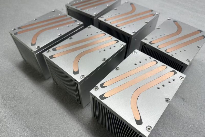 Top view of 150W laser module heat pipe heat sinks showing copper heat pipes routed across the base plate