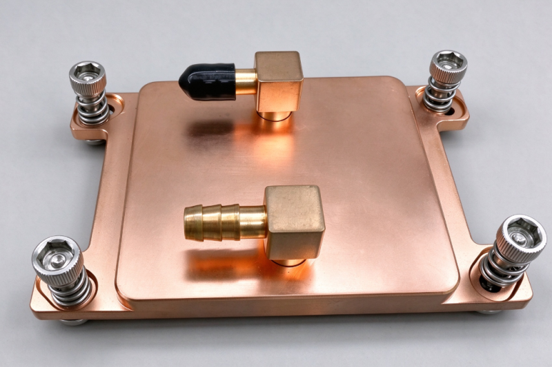 Copper liquid cold plate water block with spring-loaded mounting screws and brass fittings